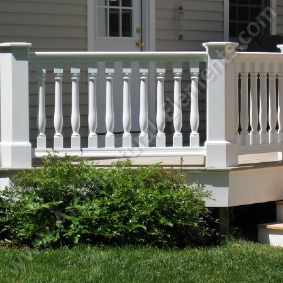 Decorative balusters and newel posts supporting an exterior railing system