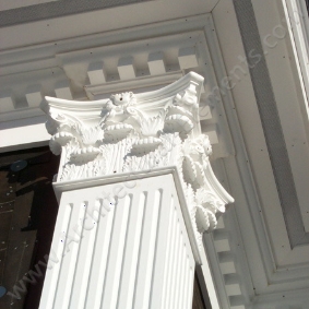 Decorative exterior corbels supporting an architectural overhang