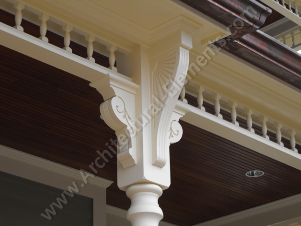 Restored facade of the Historic Victorian Mansion with decorative millwork.